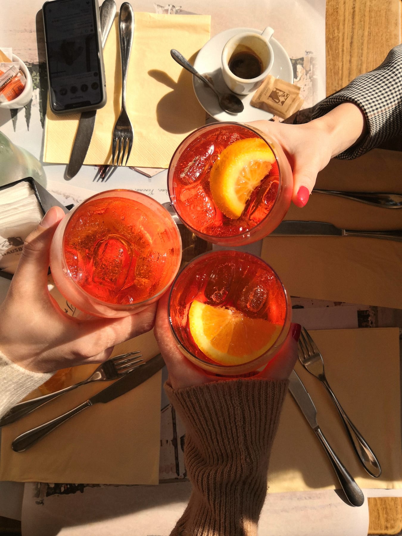 Friends raising spritzes together