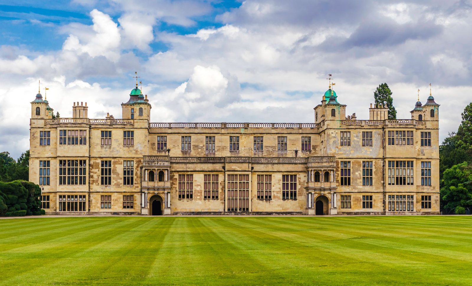 Audley End House, a grand Jacobean mansion behind a striped lawn in Essex