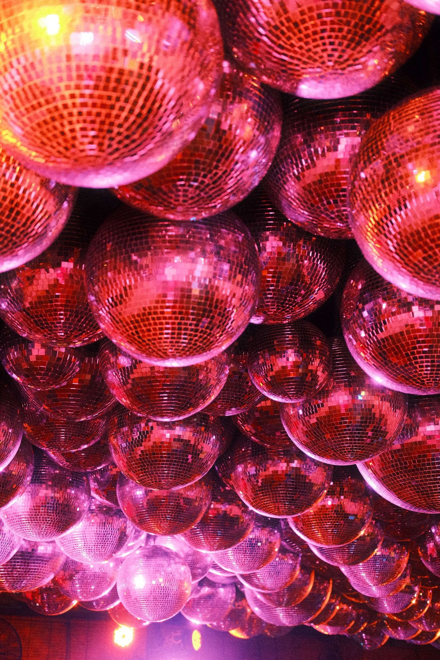 A dynamic array of shimmering disco balls creating a lively atmosphere