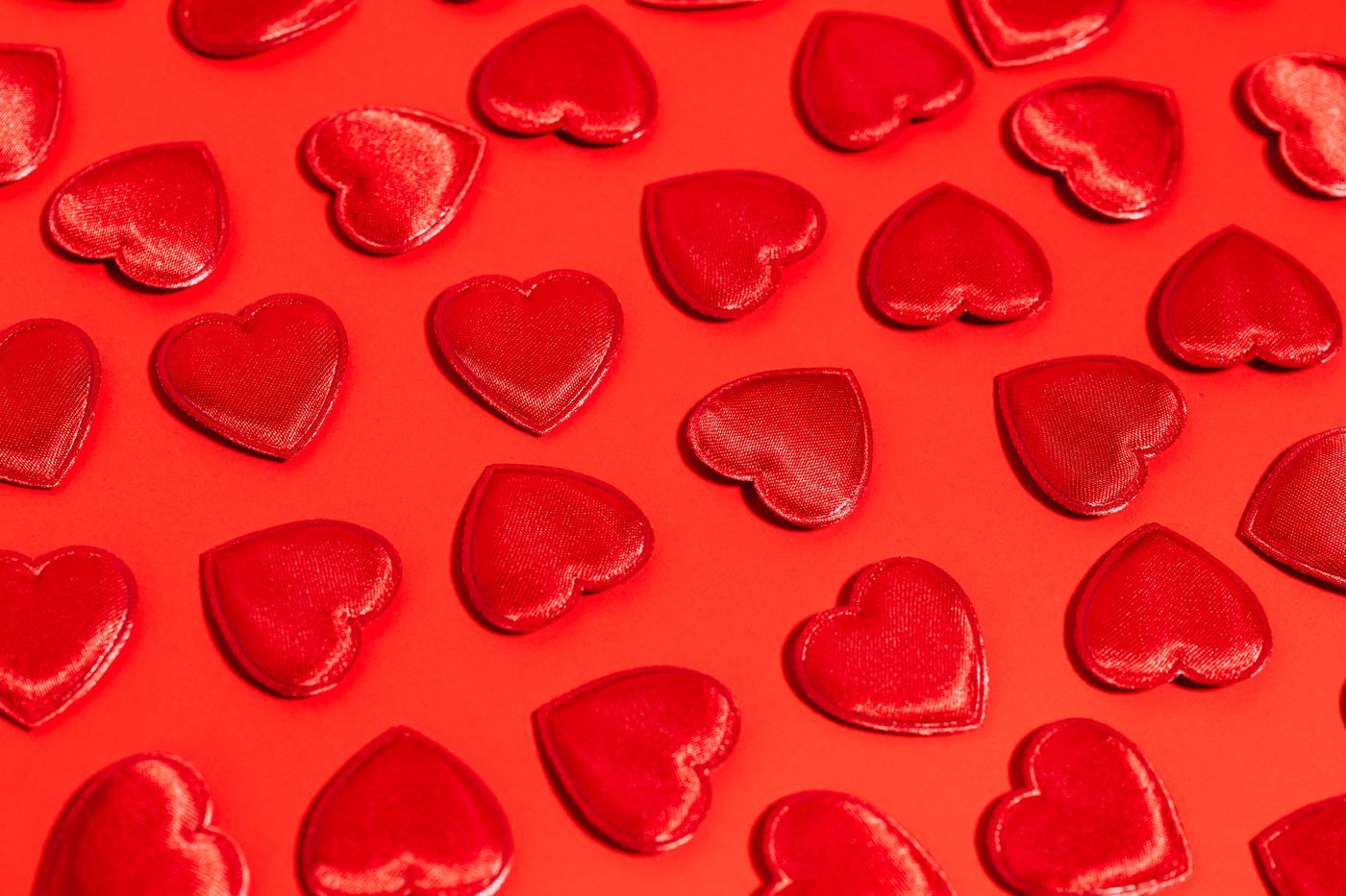 Festive red hearts on a bold red background perfect for Valentine's Day themes