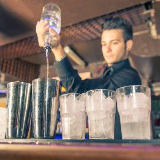 Bartender pouring cocktails