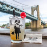 a cocktail from a Bristol cocktail class in front of Clifton suspension bridge